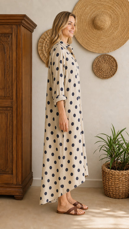 Side view of beige polka dot maxi shirt dress on model