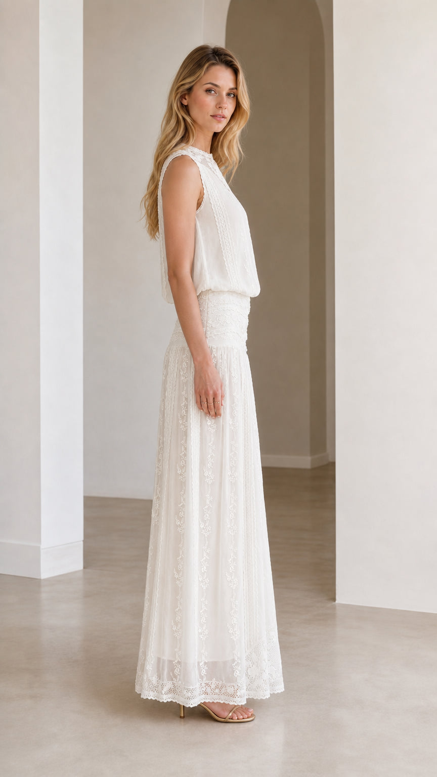 Side profile view of white lace maxi dress