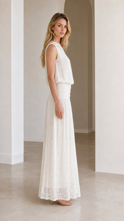 Side profile view of white lace maxi dress