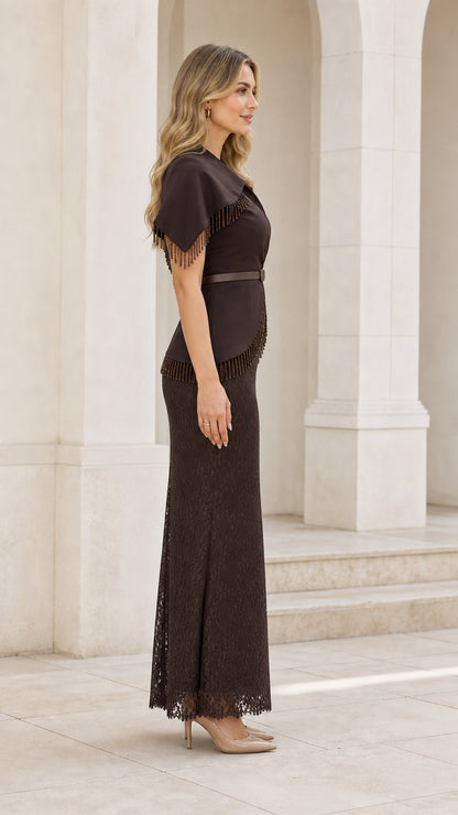 Side profile view of woman in brown formal gown