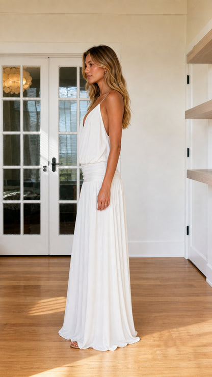 Side profile view of white maxi dress