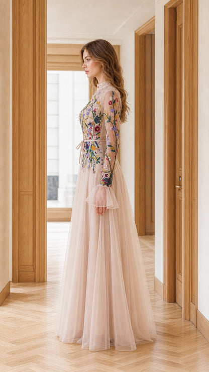 Side profile view of blush floral embroidered A-line tulle evening gown