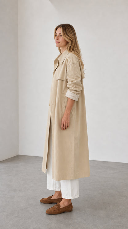 Side profile view of beige trench coat