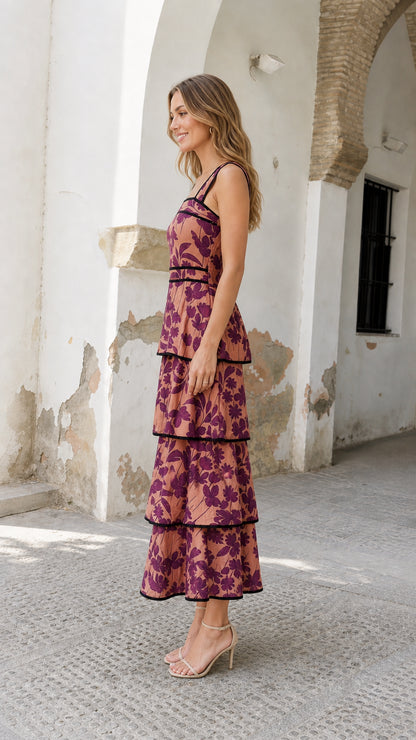 Side view of model wearing rose pink floral tiered midi dress