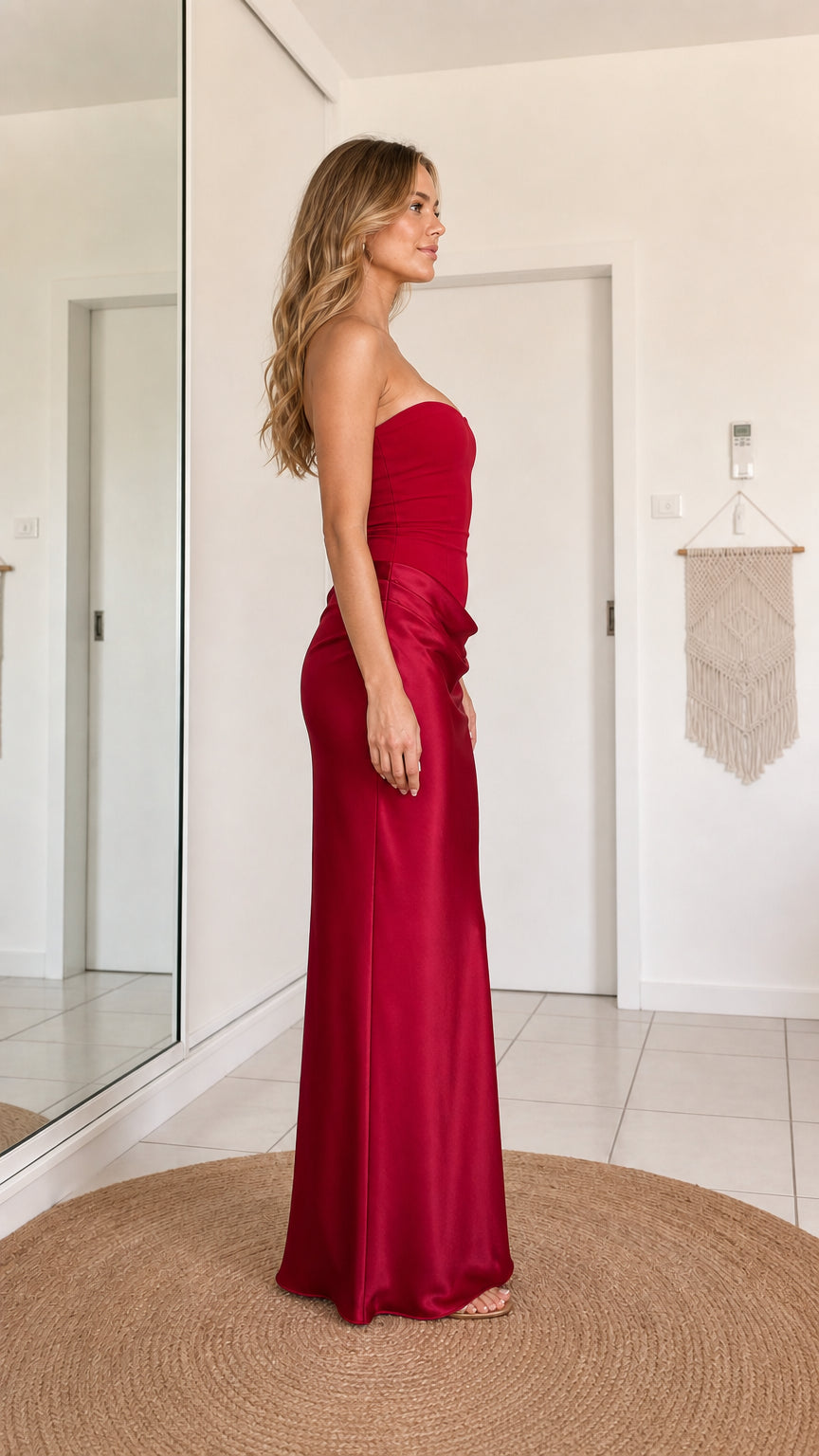 Burgundy strapless floor-length dress shown from the side