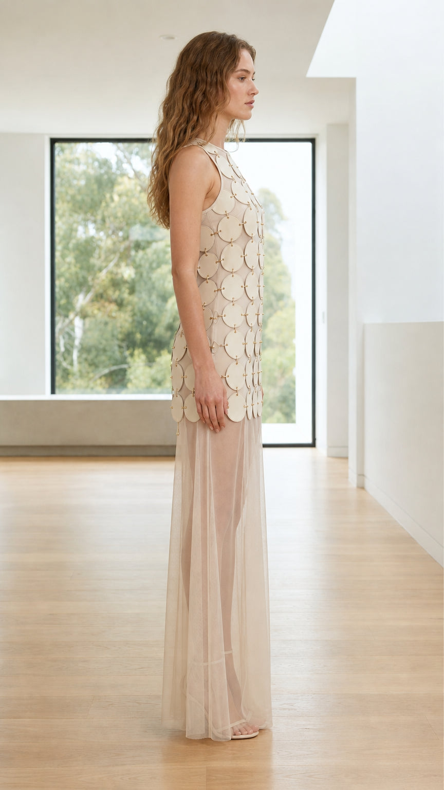 Side profile view of beige maxi dress with sheer overlay