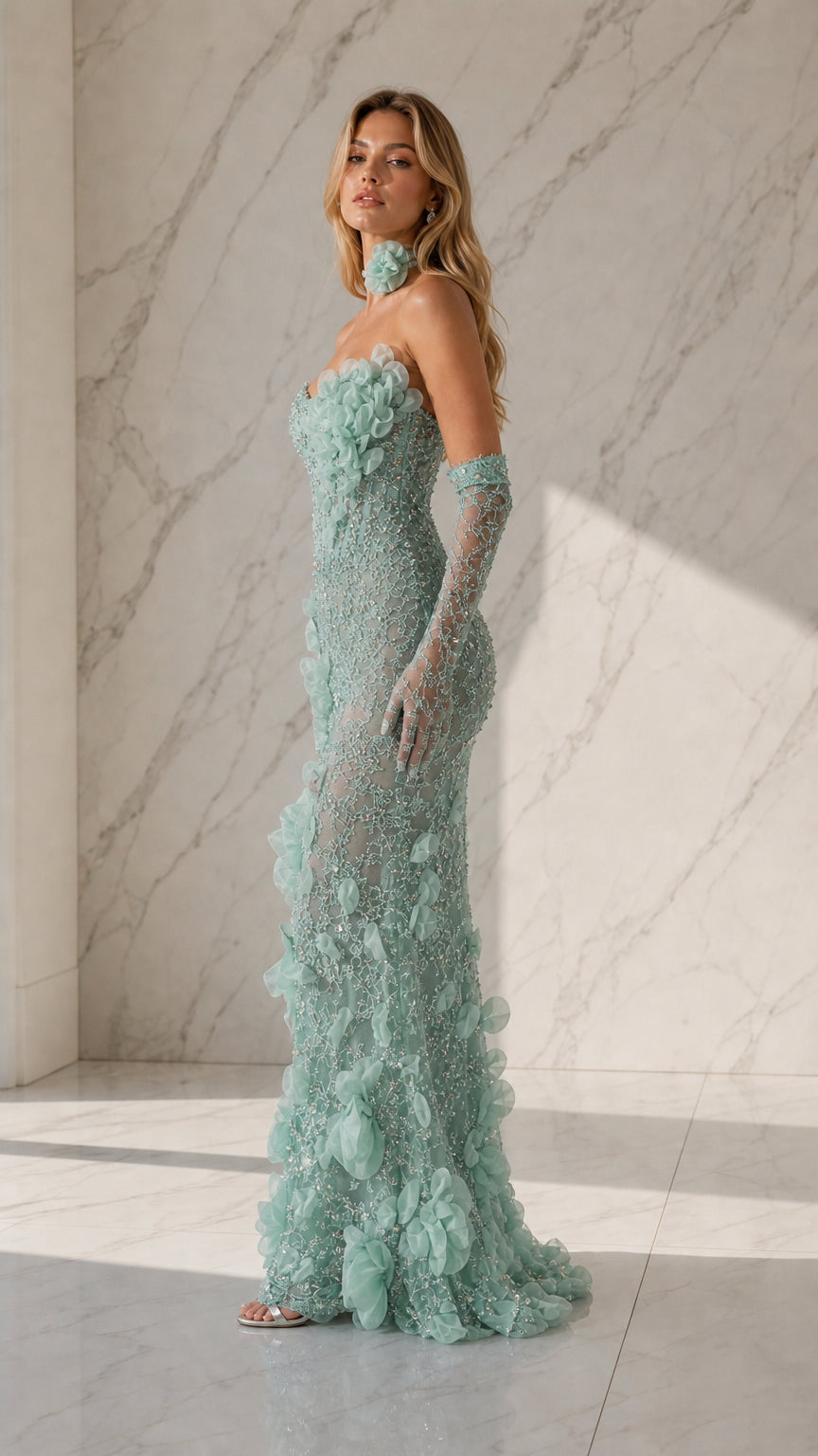 Side profile view of sage green formal gown and matching gloves