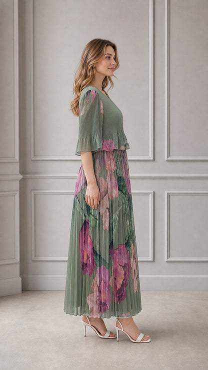 Side angle view of sage green pleated floral maxi dress with flutter sleeves