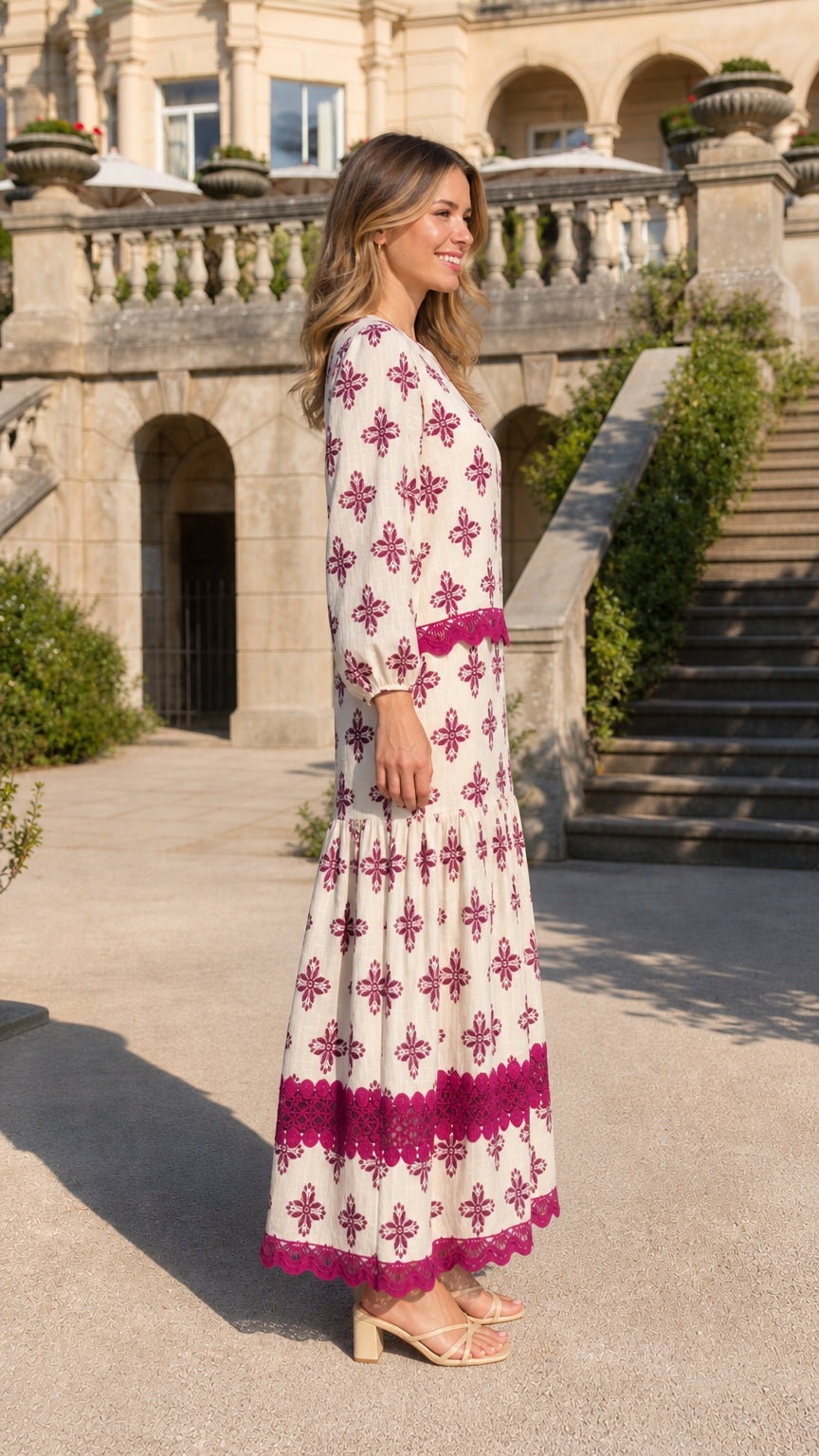 Side profile view of ivory maxi dress on model