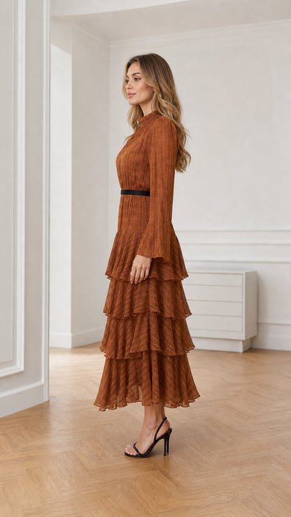 Side profile of model wearing the rust tiered maxi dress with black waist detail
