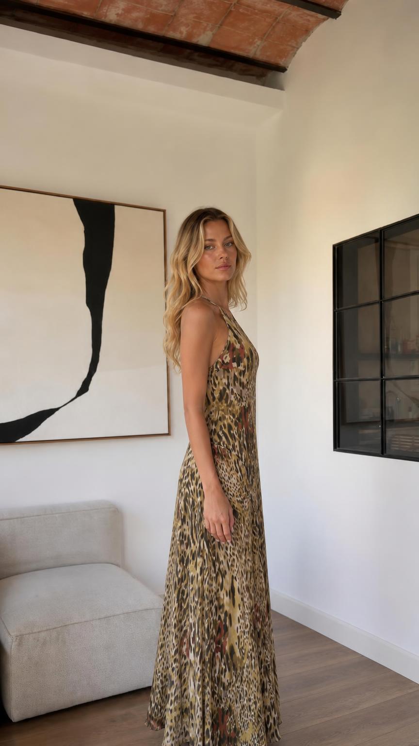 Side profile of woman wearing khaki animal print maxi dress