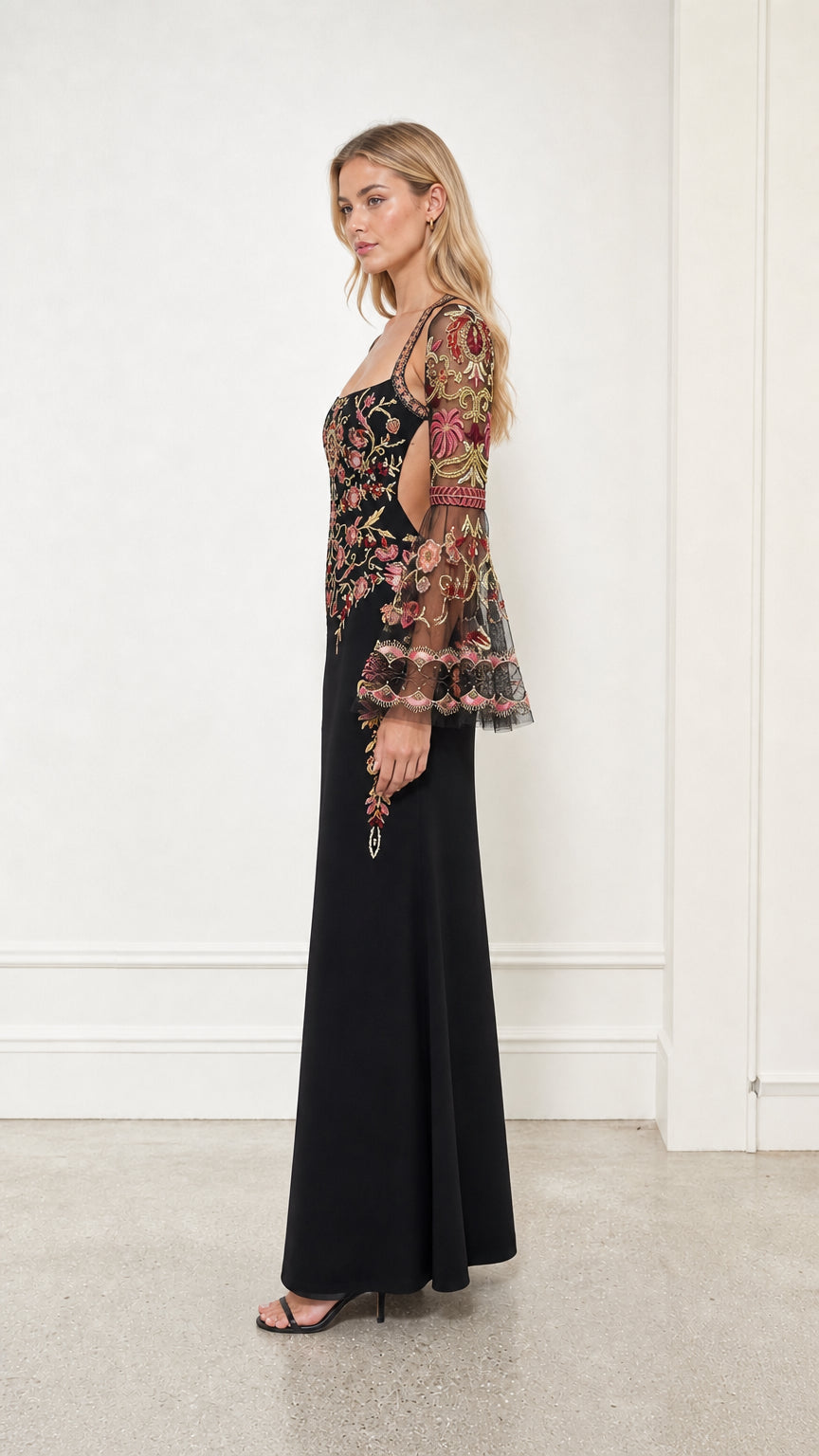 Side profile view of black embroidered evening gown