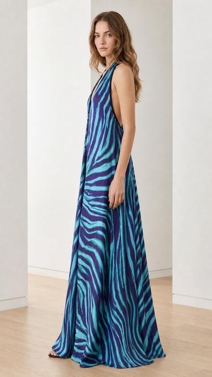 Side profile of woman in blue zebra print maxi dress