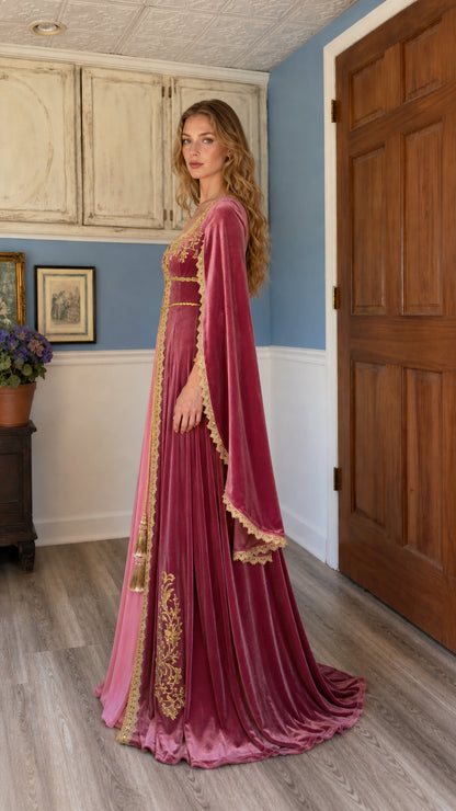Side profile of the pink velvet medieval gown showing floor-length drape