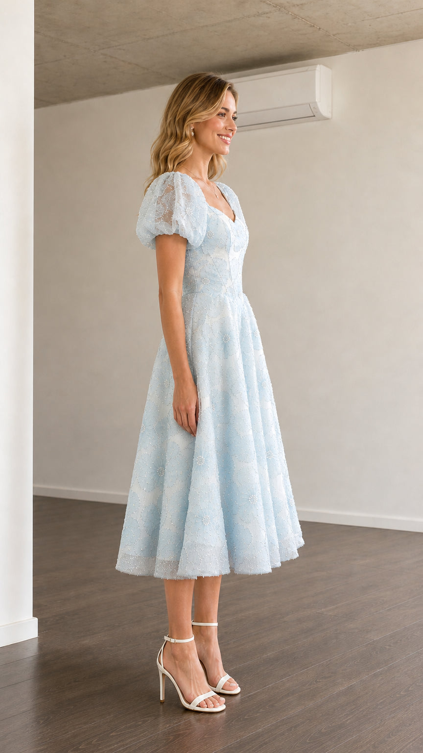 Side profile view of light blue midi dress