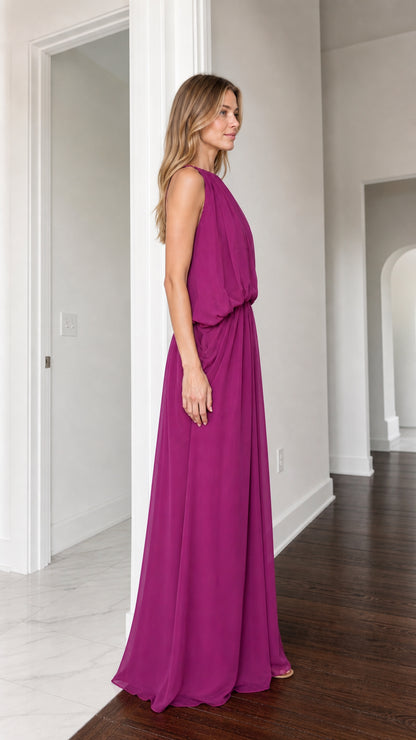 Side view of woman in flowing magenta floor-length evening dress
