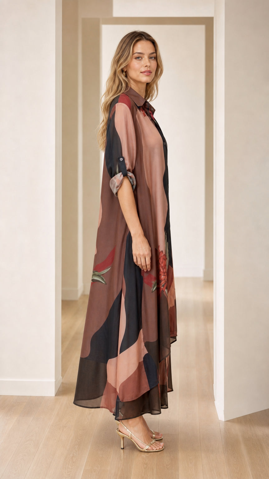 Side profile of model wearing brown abstract floral maxi shirt dress