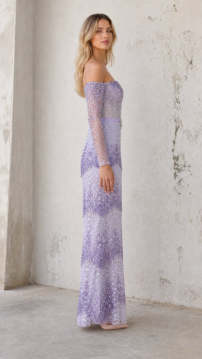 Model wearing lavender embellished gown, side profile view