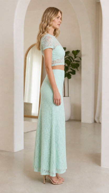 Side view of mint lace matching set on model wearing heels