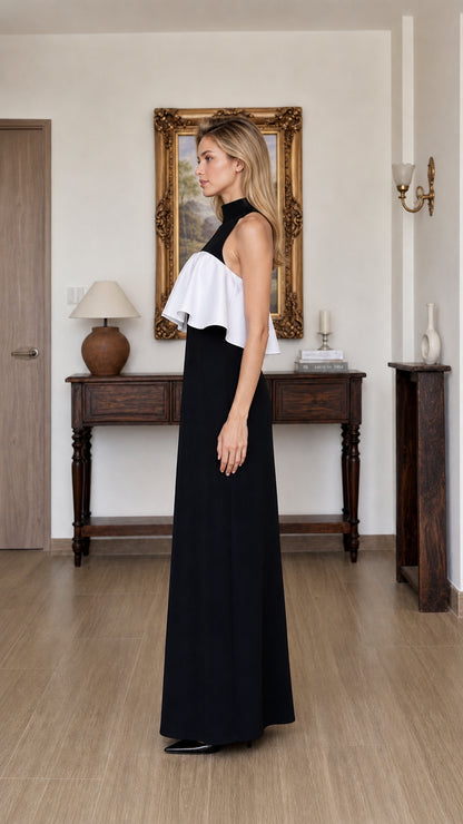 Side profile view of black and white ruffle maxi dress