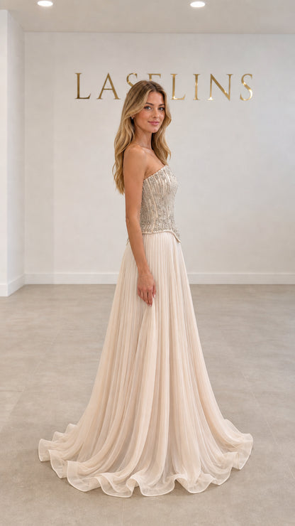 Champagne pleated evening dress with embellished corset bodice side angle view