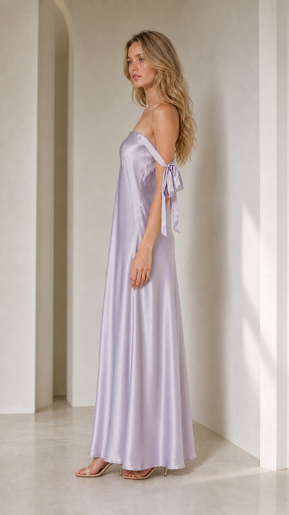 Model in lavender satin maxi dress from side profile