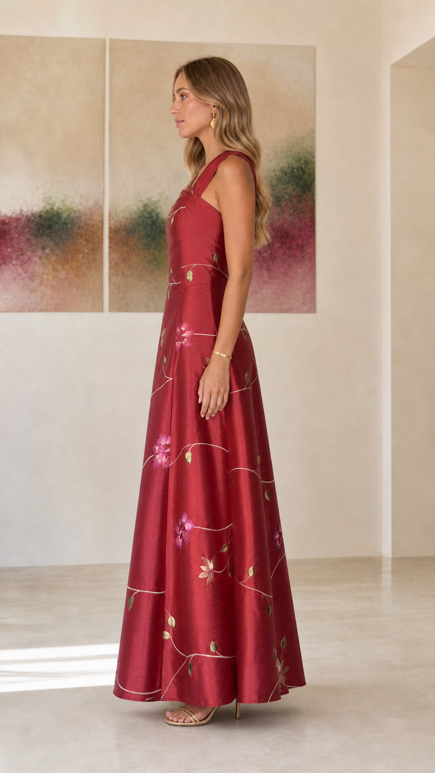 Side profile view of burgundy evening dress