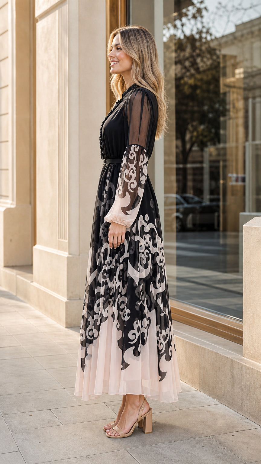 Model wearing black and blush scroll print chiffon maxi dress side view