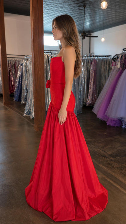 Side profile view of red mermaid evening gown