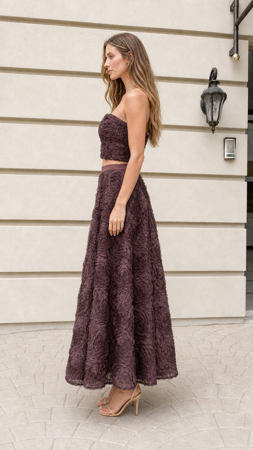 Side profile of the plum strapless crop top and maxi skirt