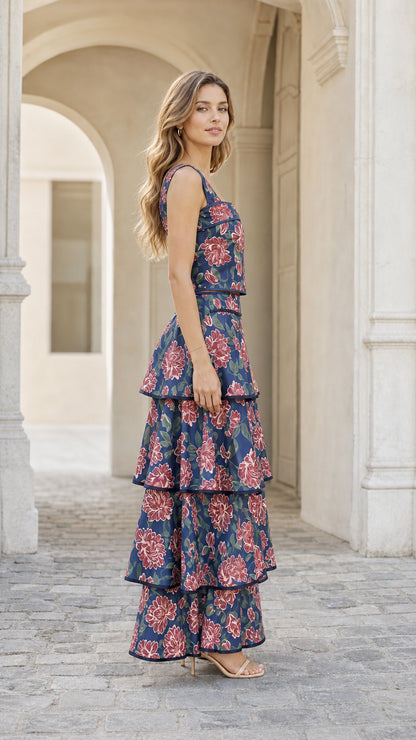 Side profile of woman in navy floral tiered maxi dress