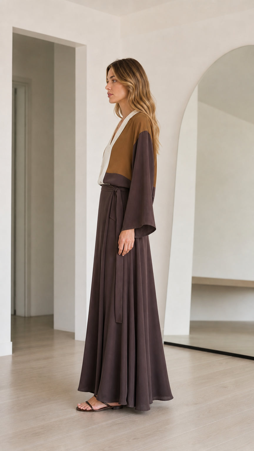 Side profile of model wearing Brown Colorblock flowy maxi dress