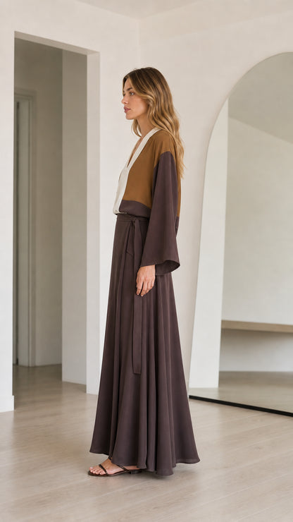 Side profile of model wearing Brown Colorblock flowy maxi dress