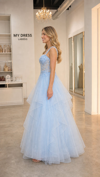 Side profile view of light blue tulle ball gown