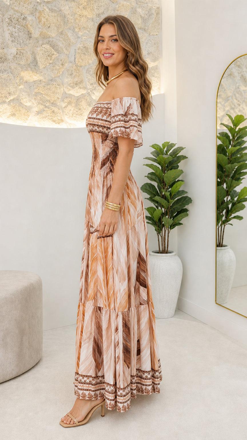 Side profile view of woman in beige maxi dress