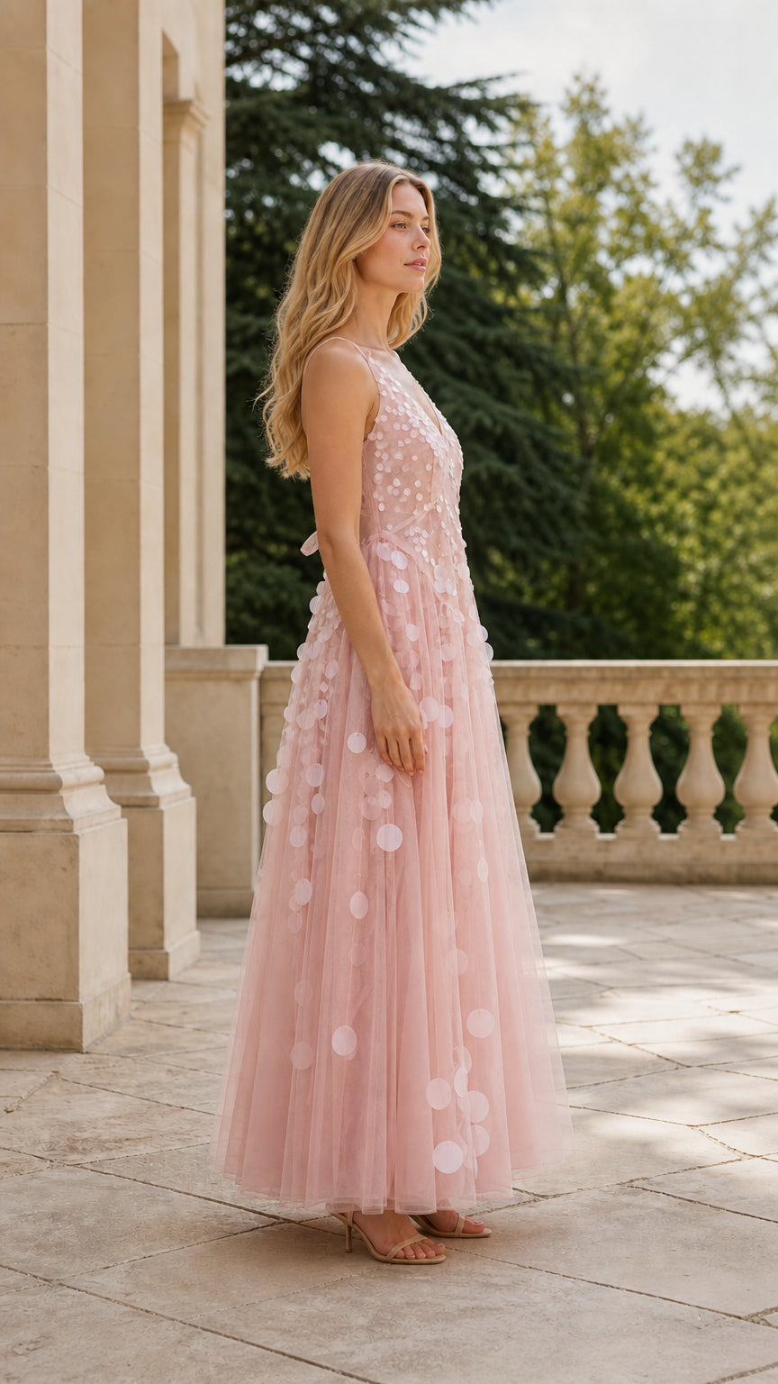 Side profile of woman in pink evening gown