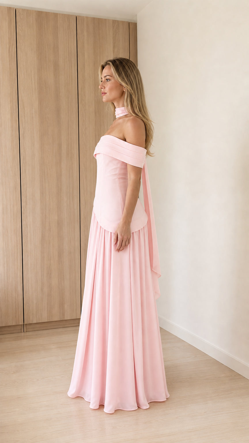 Side profile view of pink maxi dress