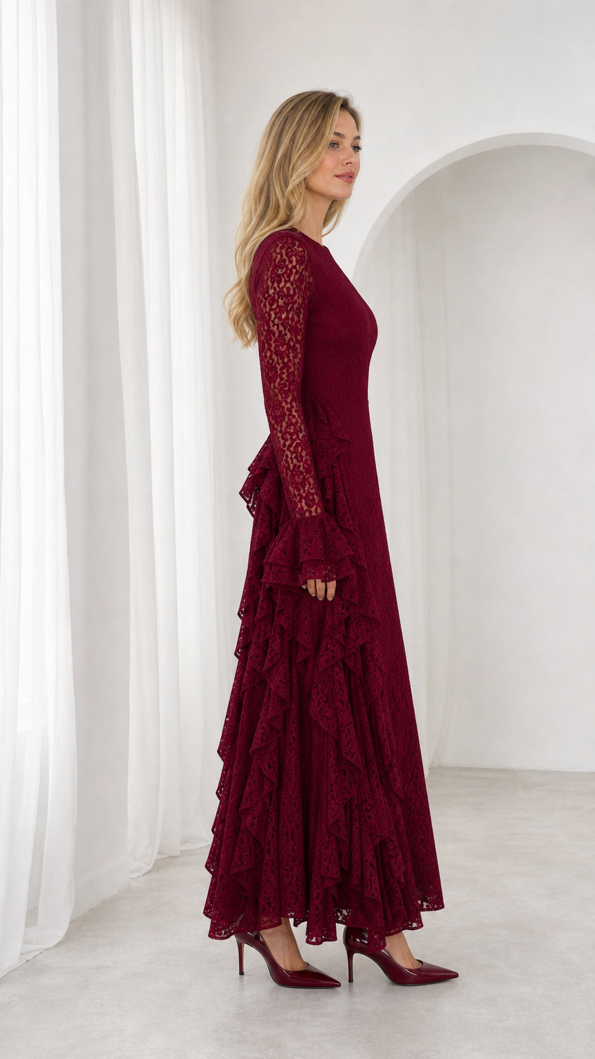 Side profile view of burgundy lace maxi dress showcasing vertical ruffled accents