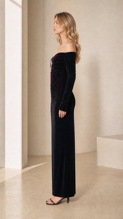 Side profile view of black velvet off-the-shoulder evening gown