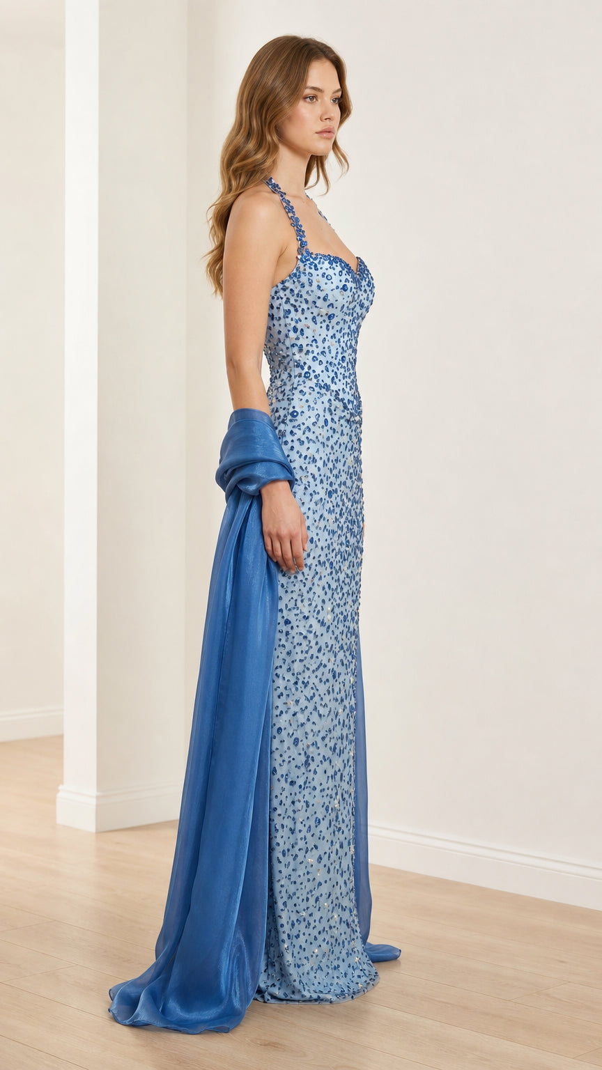 Side profile of light blue beaded evening gown