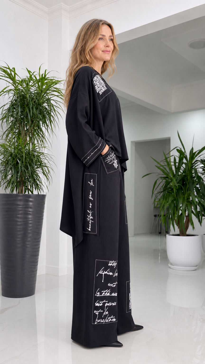 Side profile view of woman in black pant set