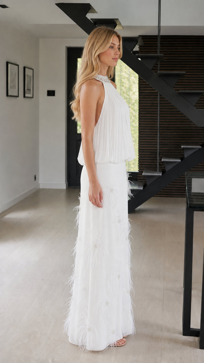 Side view of white formal dress with feather accents