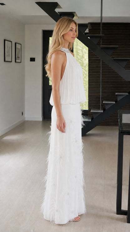 Side view of white formal dress with feather accents