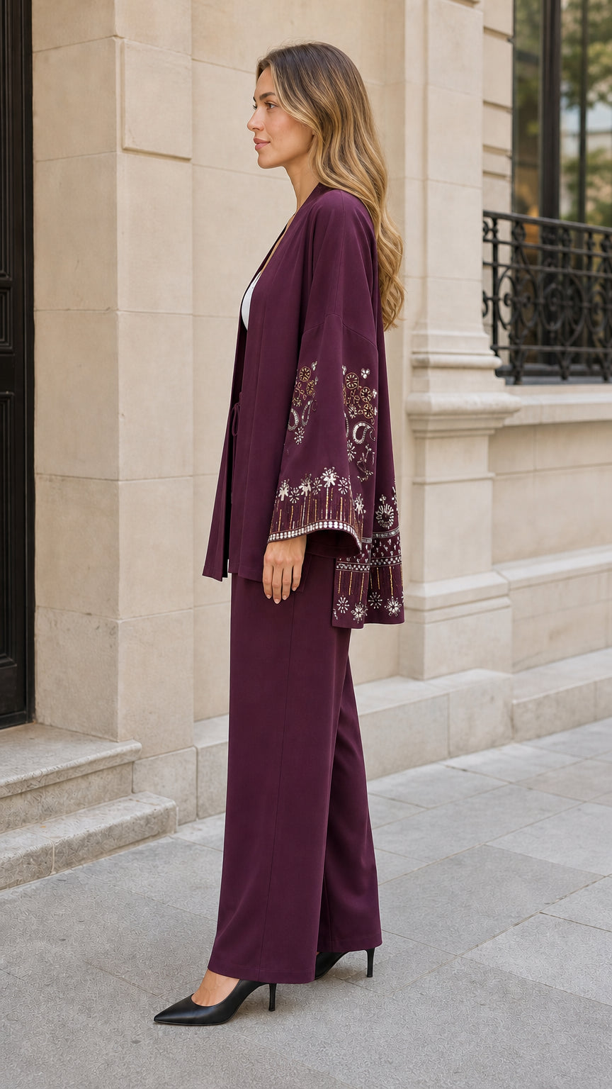 Side profile view of women's relaxed fit plum pant set