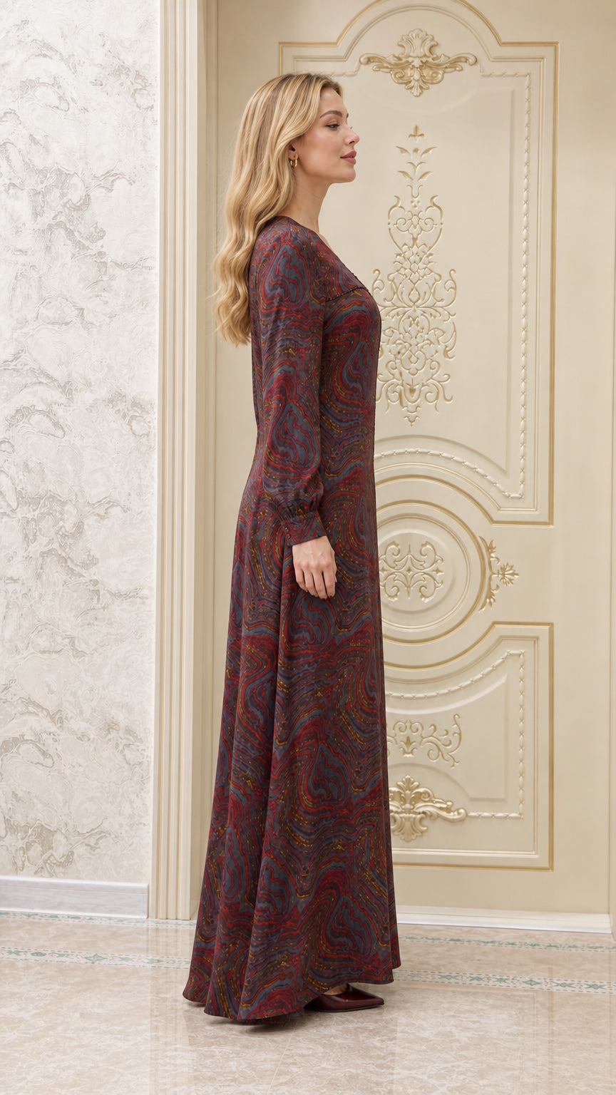 Side profile of model wearing burgundy multi swirl print maxi dress