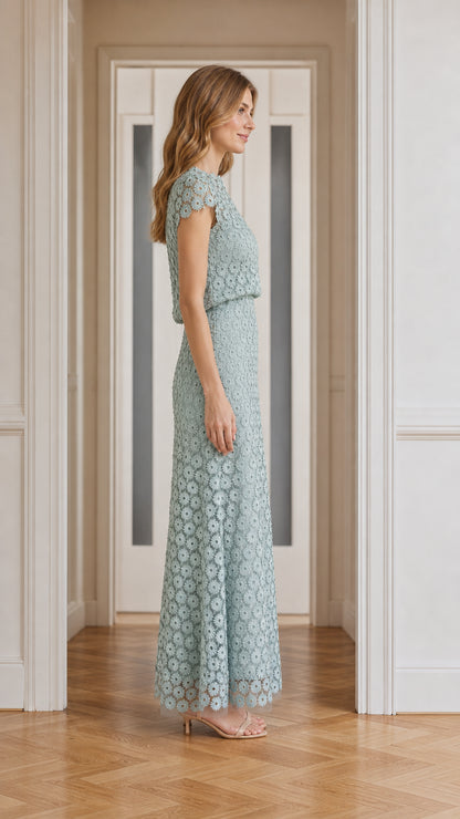 Model wearing sage green floral lace maxi dress, side profile
