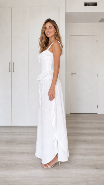 Model wearing white two-piece set, side view