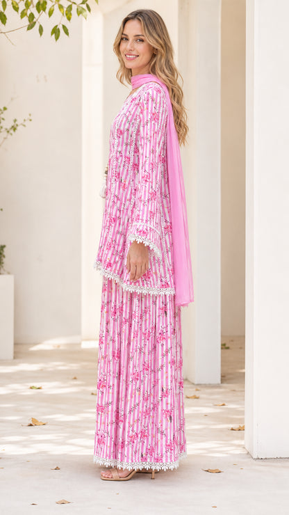 Side profile of model in pink 3-piece floral set