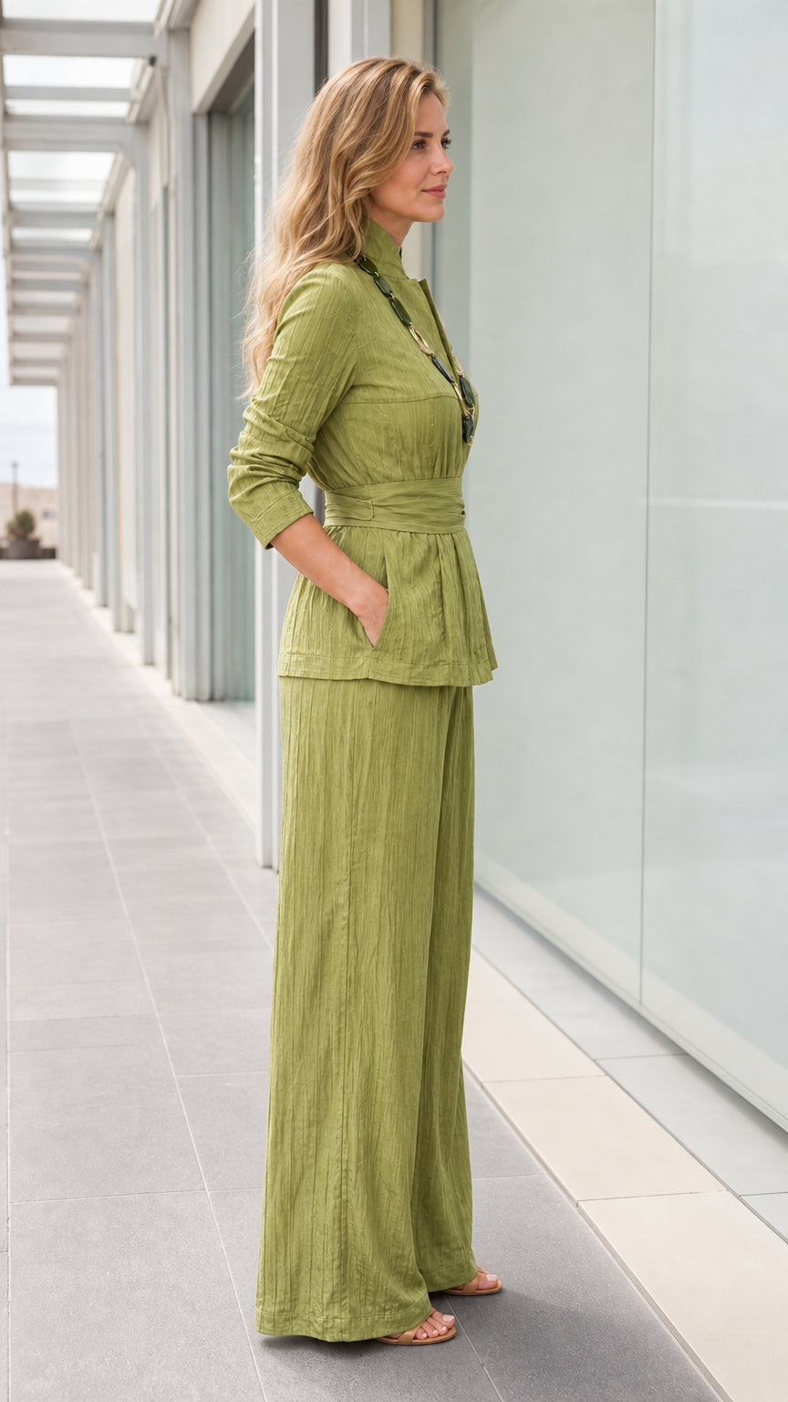Side profile of woman in sage green matching set showing pocket detail