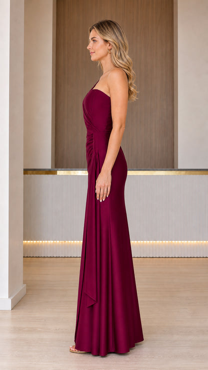 Side profile view of burgundy evening gown